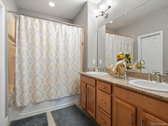 a bathroom with a bathtub and a sink