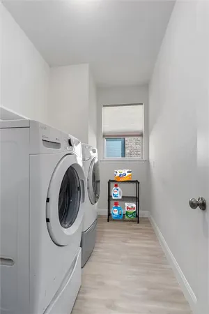 a view of livingroom with washer and dryer