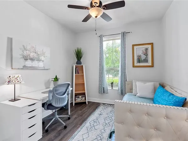 a bedroom with furniture and a window