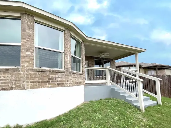 a view of house with a swimming pool