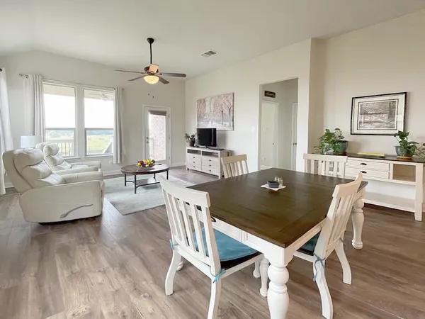 a view of a dining room with furniture window and wooden floor