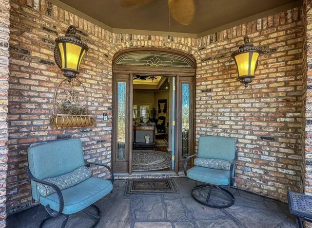 a view of sitting area with furniture and a gate