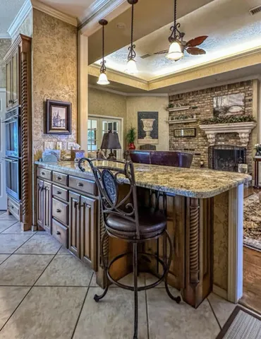 a dining room with furniture and a large window