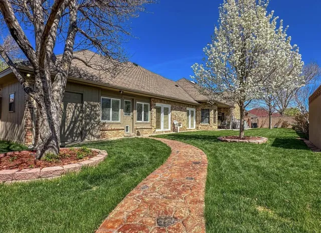 a view of a patio with a table and chairs