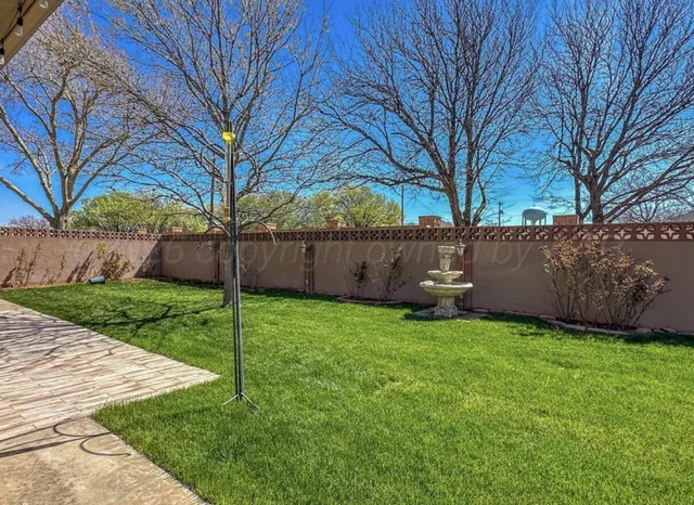 a view of a patio with table and chairs potted plants with wooden floor