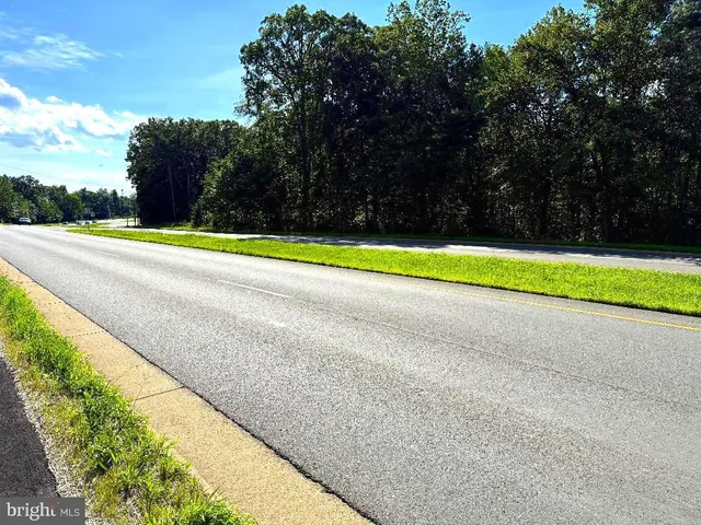 a view of swimming pool with an outdoor space and seating area