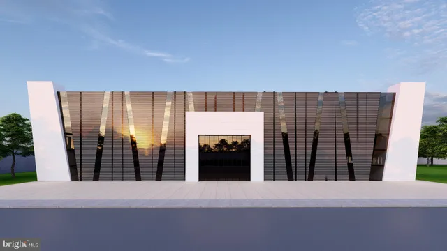 a front view of a house with garden and trees