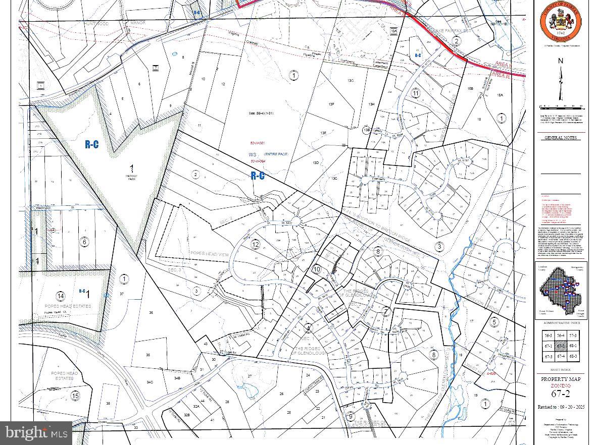 11625 Braddock Road Fairfax, VA 22030 - Photo 9 of 11 a view of white house with a snow and a wall