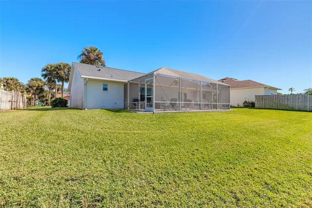 a view of a house with a garden and yard