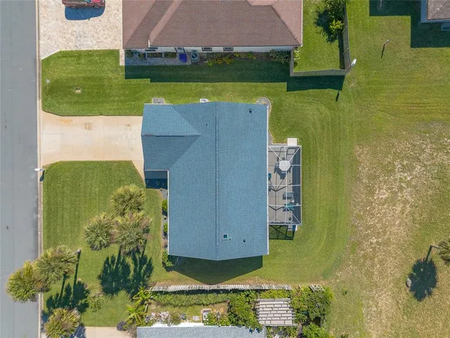 an aerial view of a house with a garden