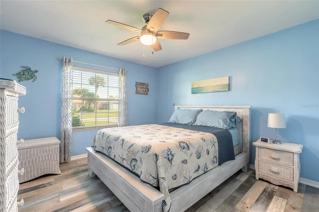 a bed room with a bed and a chandelier