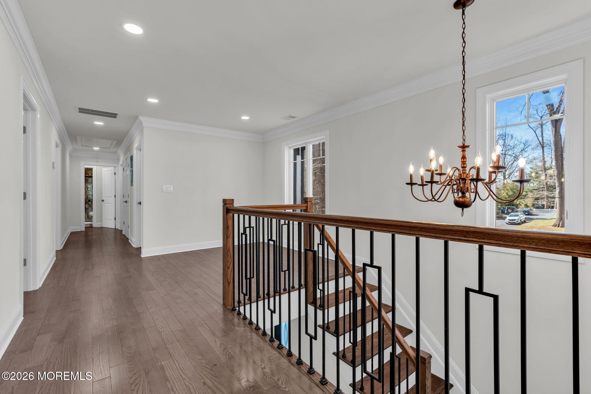 58 Fish Hawk Drive Middletown, NJ 07748 - Photo 13 of 33 a view of a hallway with wooden floor and chandelier