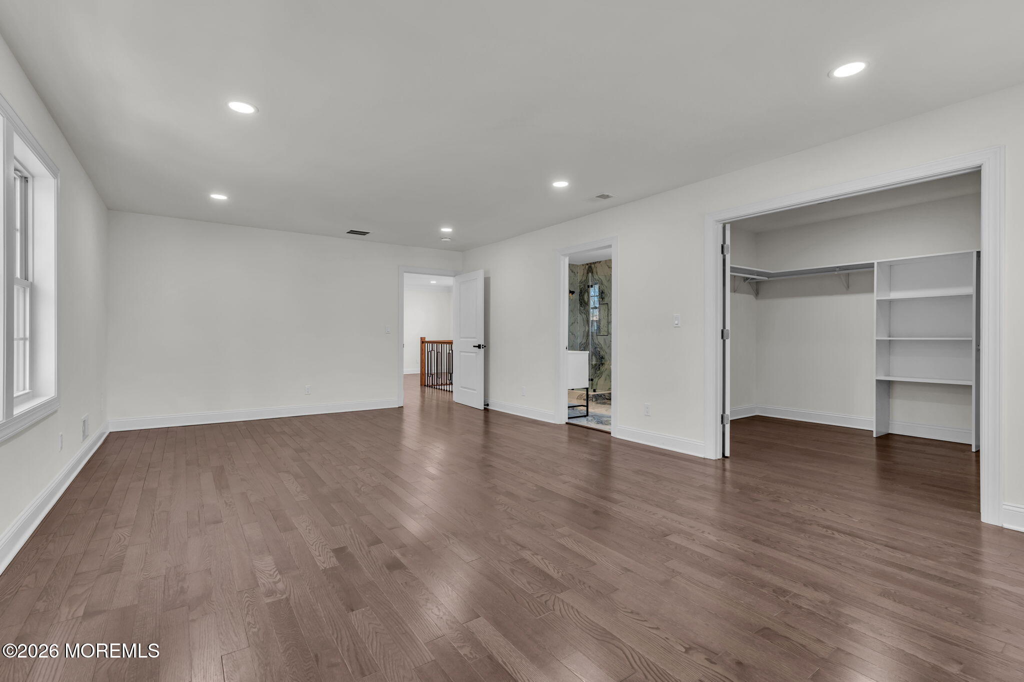58 Fish Hawk Drive Middletown, NJ 07748 - Photo 15 of 33 a view of an empty room with wooden floor and closet