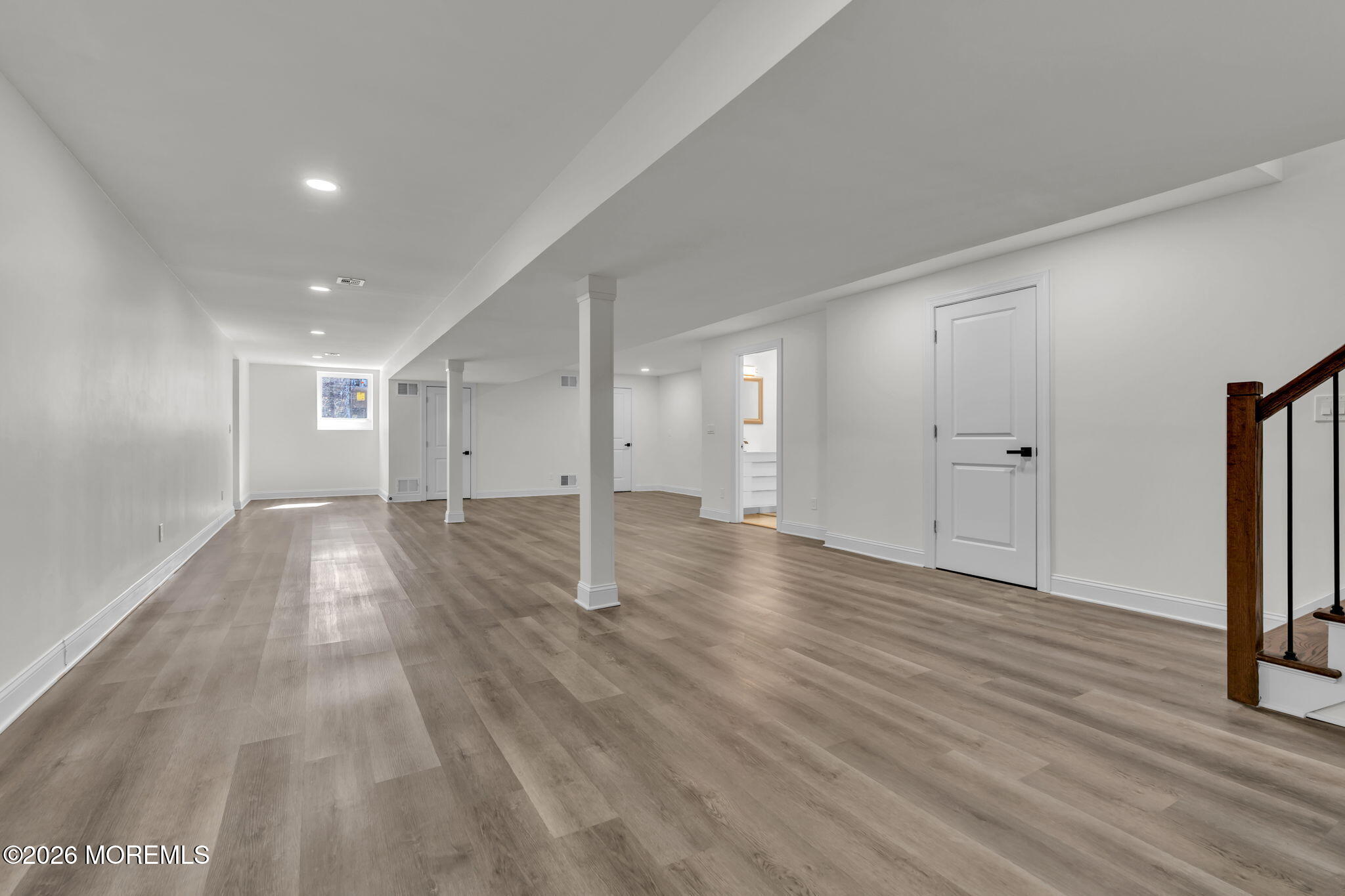 58 Fish Hawk Drive Middletown, NJ 07748 - Photo 23 of 33 a view of an empty room with wooden floor