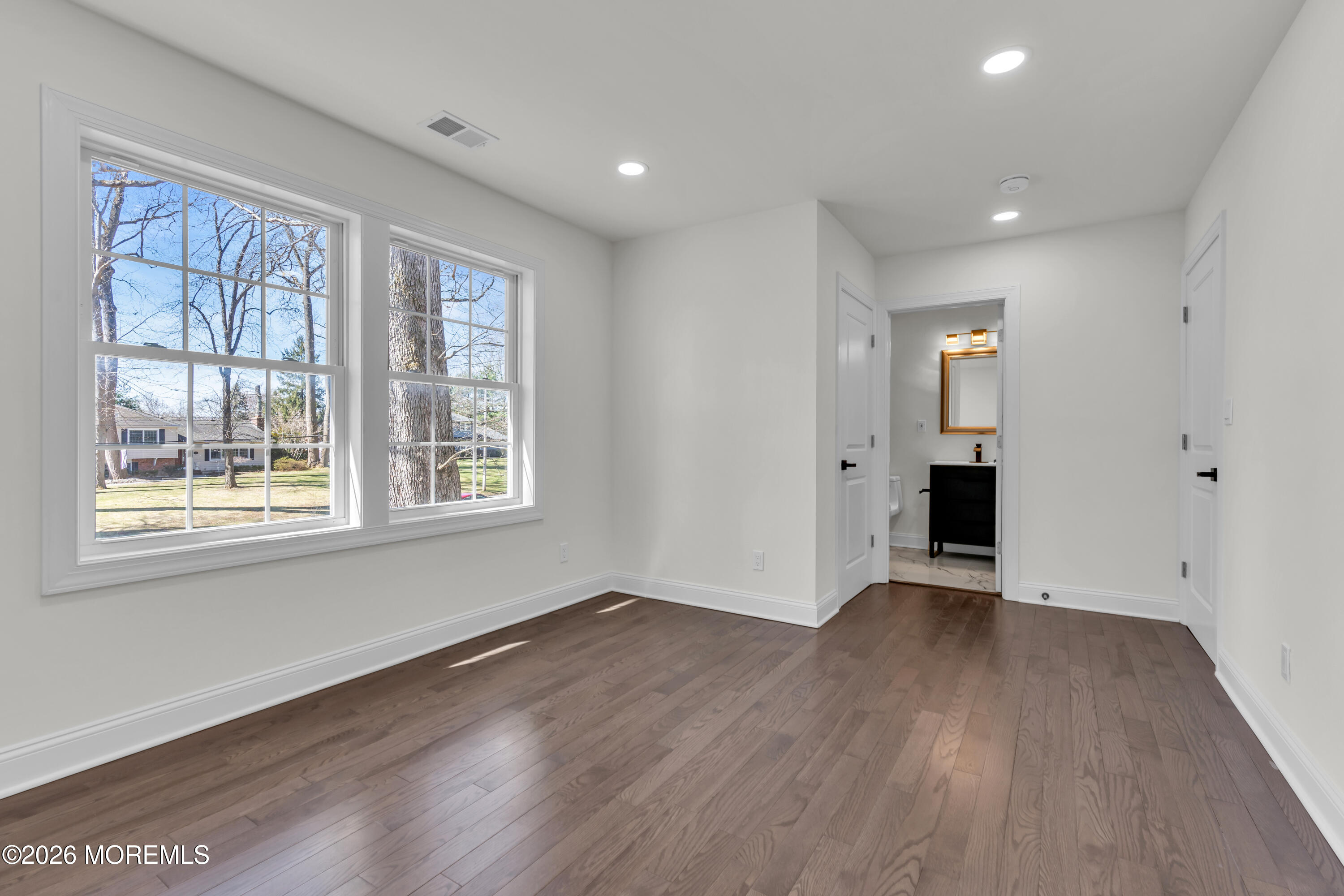 58 Fish Hawk Drive Middletown, NJ 07748 - Photo 27 of 33 a view of an empty room with wooden floor and a window