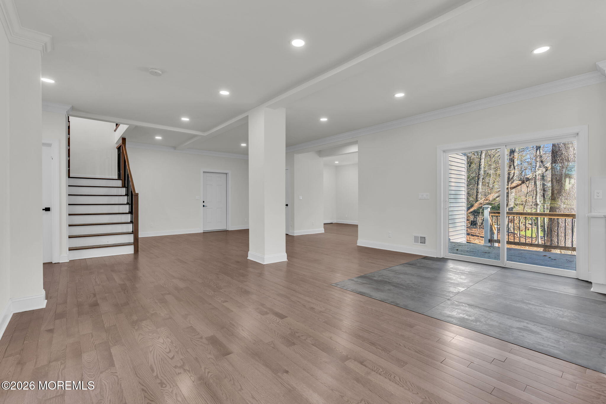58 Fish Hawk Drive Middletown, NJ 07748 - Photo 5 of 33 a view of an empty room with wooden floor and windows