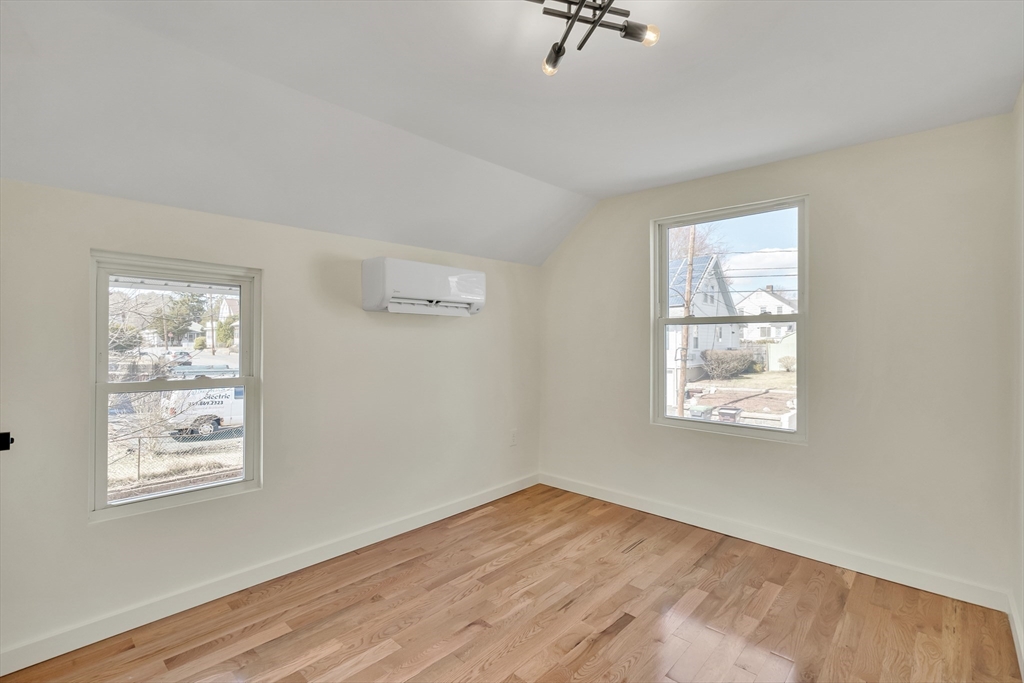 56 Riverview Street Dedham, MA 02026 - Photo 16 of 29 a view of empty room with windows