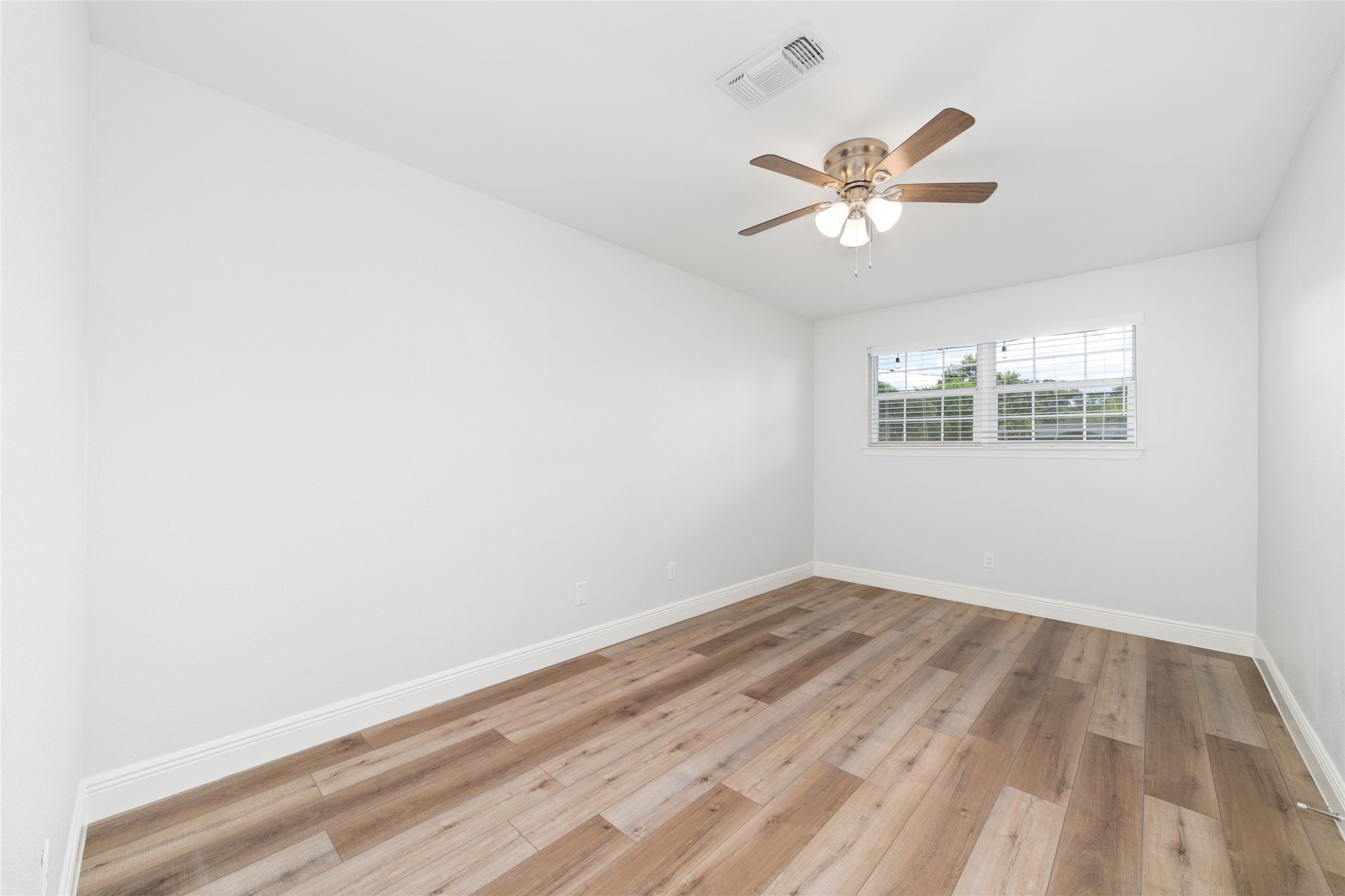 5922 Hummingbird Street Houston, TX 77096 - Photo 20 of 26 Generously sized with excellent natural light, this room easily adapts as your needs change over time. This quiet guest suite, tucked away at the back of the home, features a generous closet with custom organization.