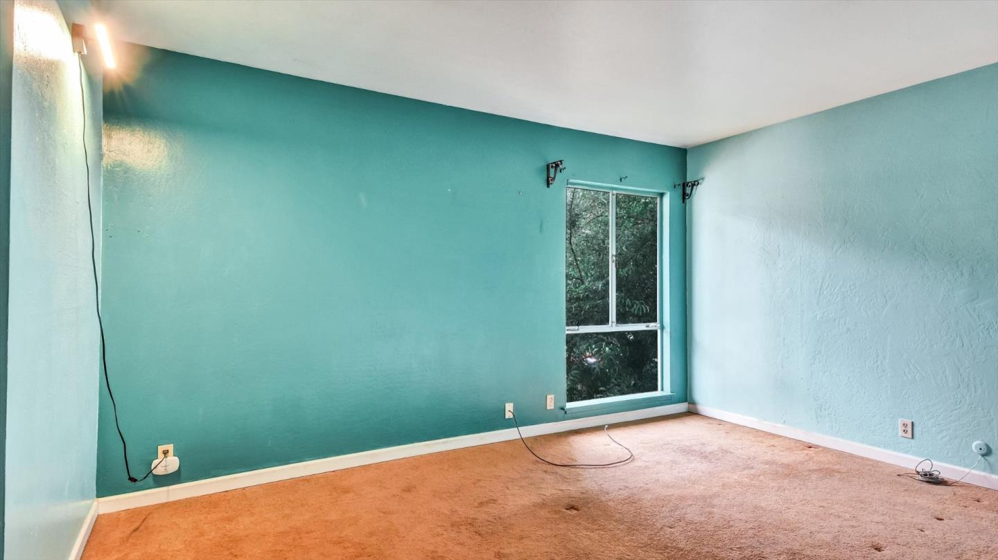 1201 Terra Nova Boulevard Pacifica, CA 94044 - Photo 17 of 28 a view of an empty room with window and stairs