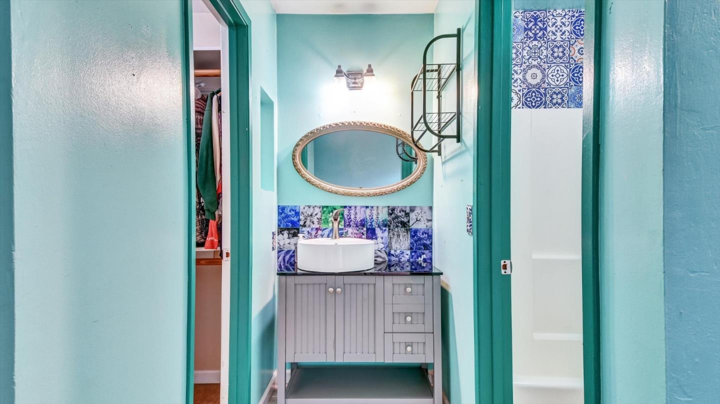 1201 Terra Nova Boulevard Pacifica, CA 94044 - Photo 21 of 28 a bathroom with a sink and a mirror