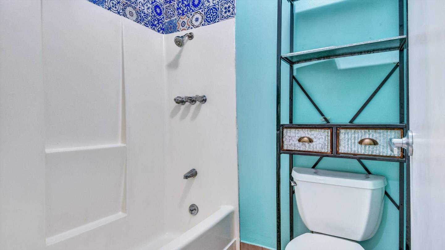 1201 Terra Nova Boulevard Pacifica, CA 94044 - Photo 23 of 28 a bathroom with a toilet and a shower