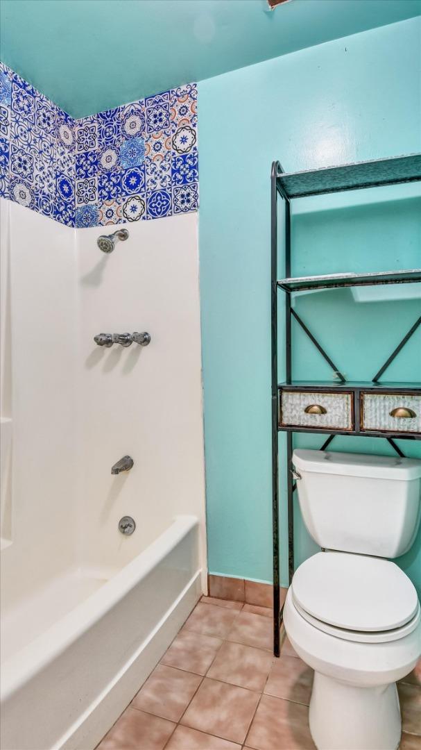 1201 Terra Nova Boulevard Pacifica, CA 94044 - Photo 24 of 28 a bathroom with a toilet and a bathtub