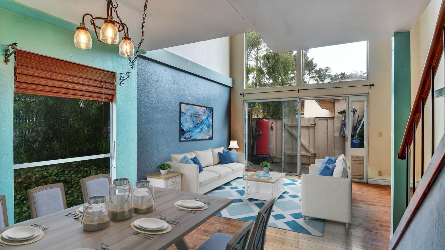 1201 Terra Nova Boulevard Pacifica, CA 94044 - Photo 5 of 28 a view of a dining room with furniture wooden floor and a chandelier