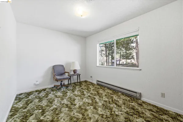 a living room with a couch and a window