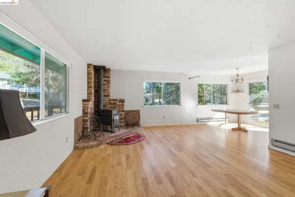 a view of a bedroom with furniture and a window