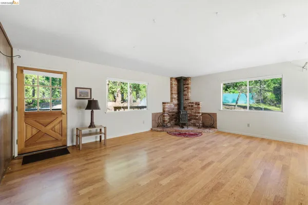 a view of a livingroom with furniture and a window