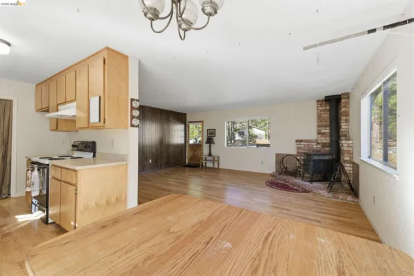 a view of a kitchen with a sink and cabinets