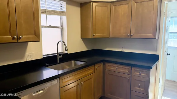 a kitchen with a sink and cabinets