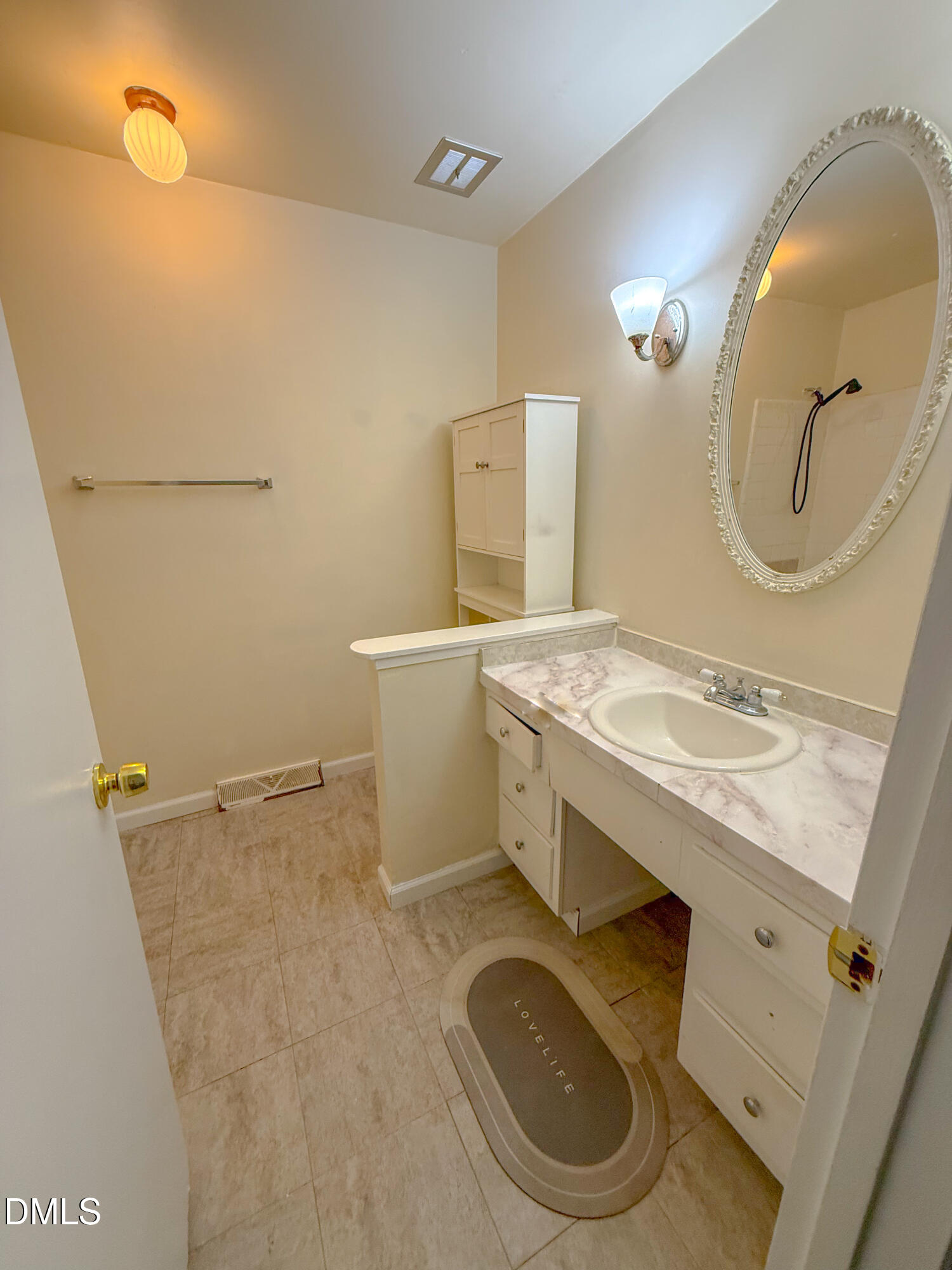 4717 Radcliff Road Raleigh, NC 27609 - Photo 8 of 11 a bathroom with a sink mirror vanity and toilet