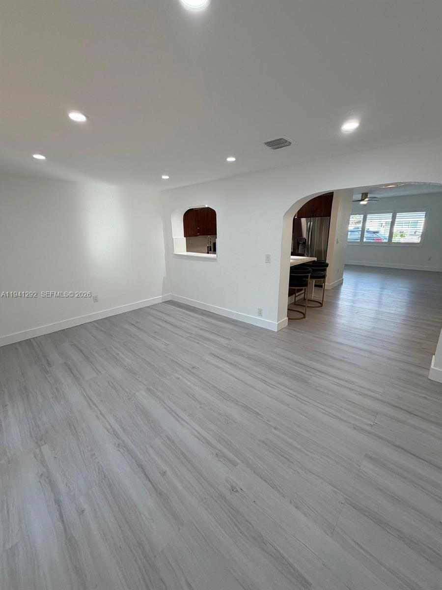 3030 Southwest 96th Avenue Miami, FL 33165 - Photo 15 of 33 an empty room with wooden floor and entrance