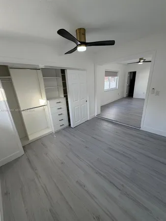 a view of a livingroom with wooden floor