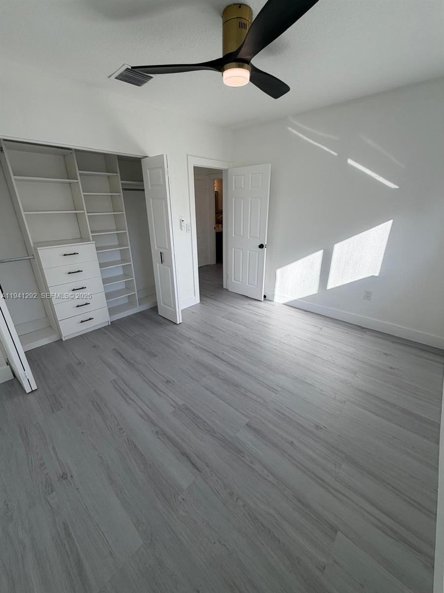 3030 Southwest 96th Avenue Miami, FL 33165 - Photo 28 of 33 wooden floor in an empty room with a window