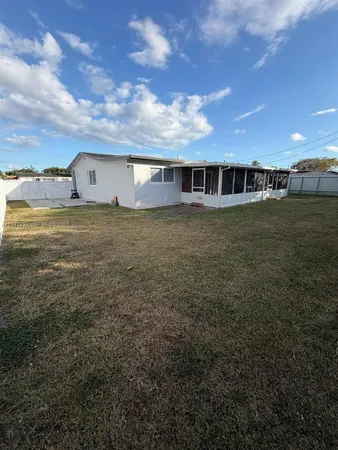 a view of a big house with a big yard