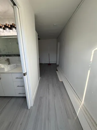 a view of a storage & utility room with a window