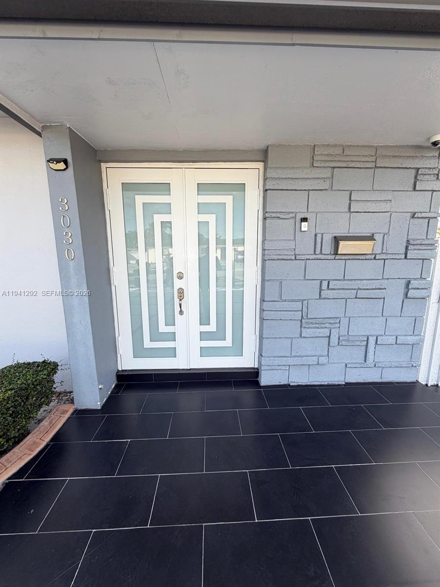 3030 Southwest 96th Avenue Miami, FL 33165 - Photo 4 of 33 a bathroom with a glass door shower and a sink