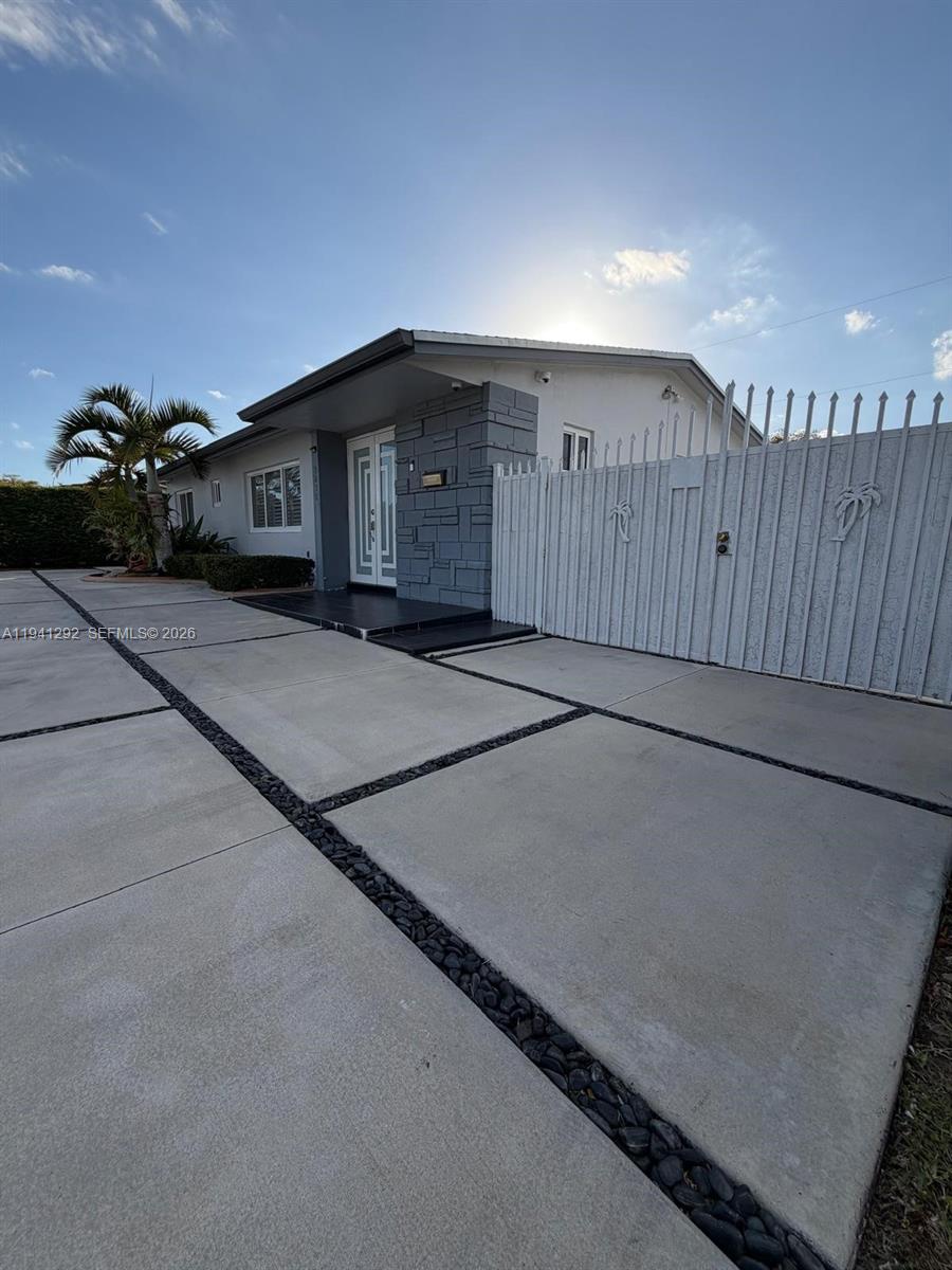 3030 Southwest 96th Avenue Miami, FL 33165 - Photo 5 of 33 a living room with a couch and potted plants