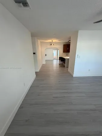 a view of a living hall with wooden floor