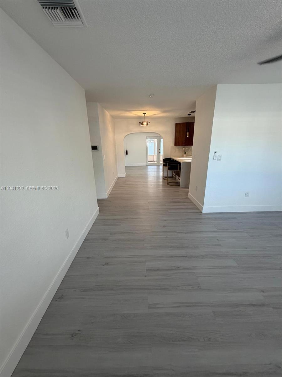3030 Southwest 96th Avenue Miami, FL 33165 - Photo 9 of 33 a view of a living hall with wooden floor