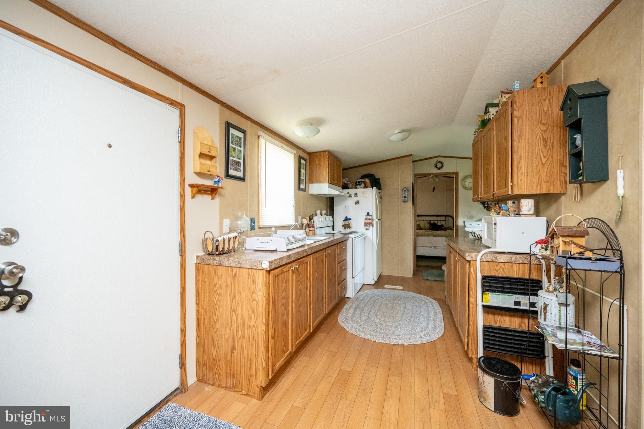 6932 New Germany Road Grantsville, MD 21536 - Photo 19 of 31 Inviting kitchen with warm wooden accents.