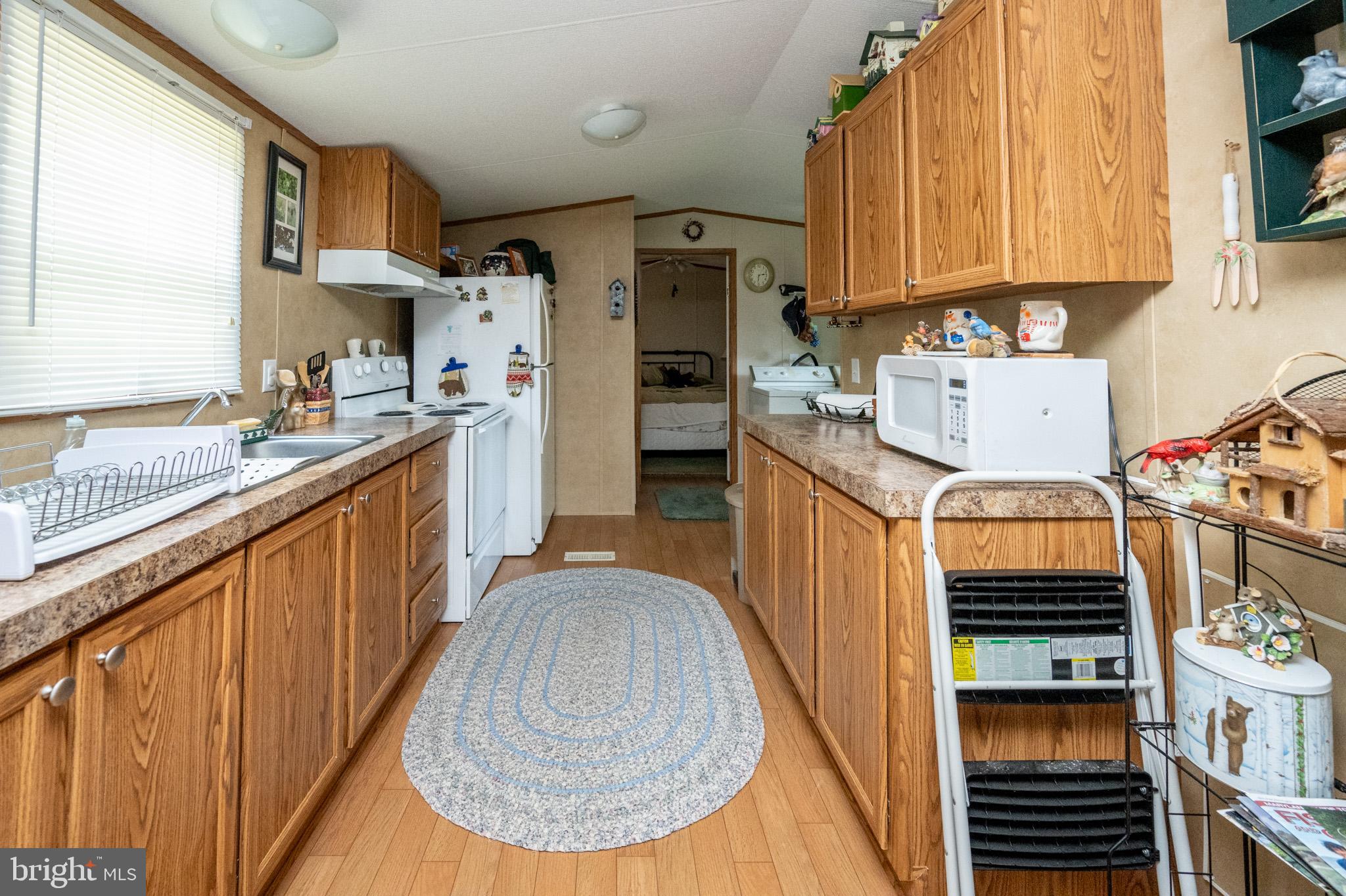 6932 New Germany Road Grantsville, MD 21536 - Photo 20 of 31 Cozy kitchen with warm wooden accents.