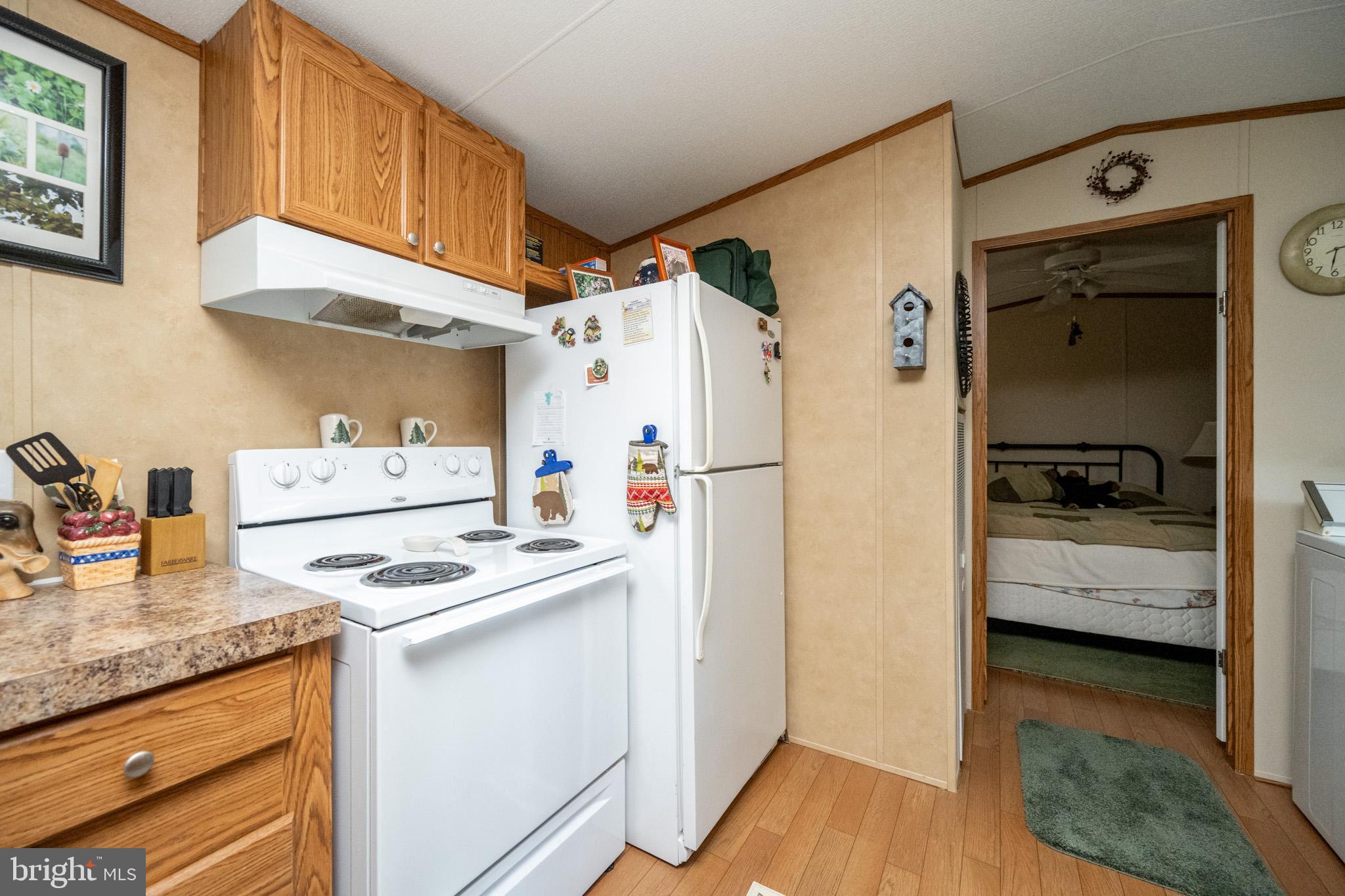 6932 New Germany Road Grantsville, MD 21536 - Photo 21 of 31 Cozy kitchen with warm wooden accents.