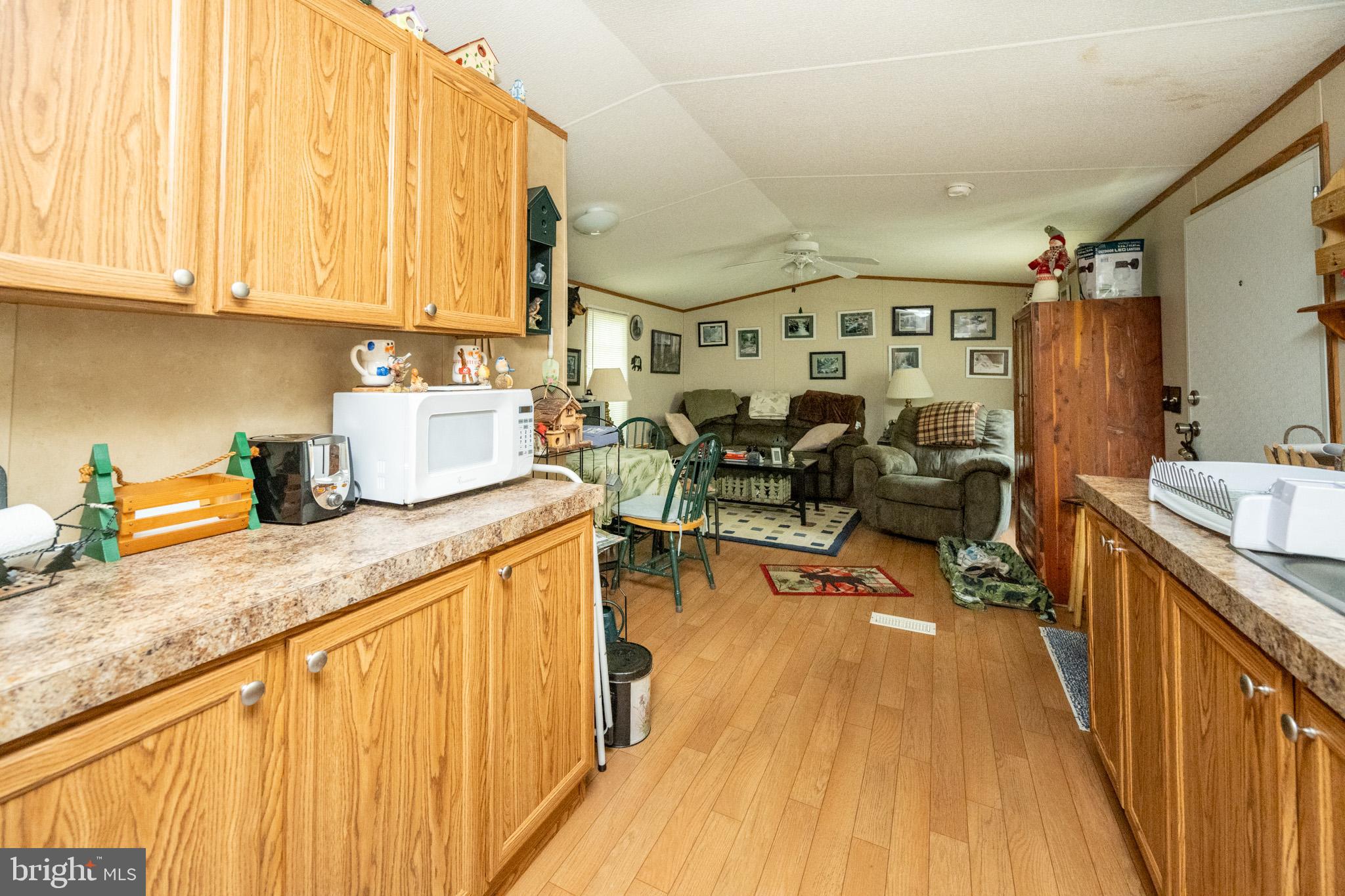 6932 New Germany Road Grantsville, MD 21536 - Photo 23 of 31 Cozy kitchen flows into inviting living space.