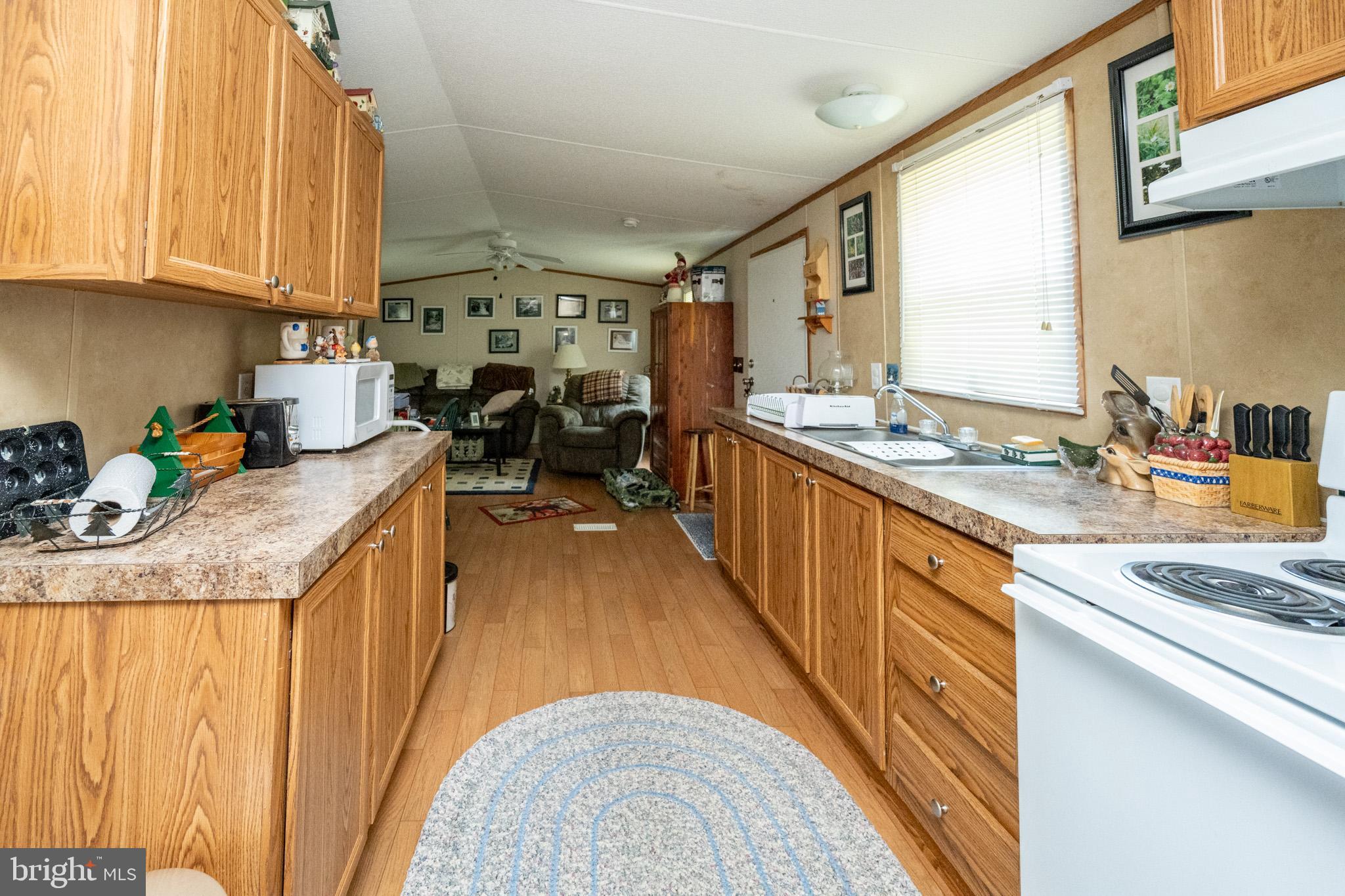 6932 New Germany Road Grantsville, MD 21536 - Photo 24 of 31 Cozy kitchen with warm wooden accents.