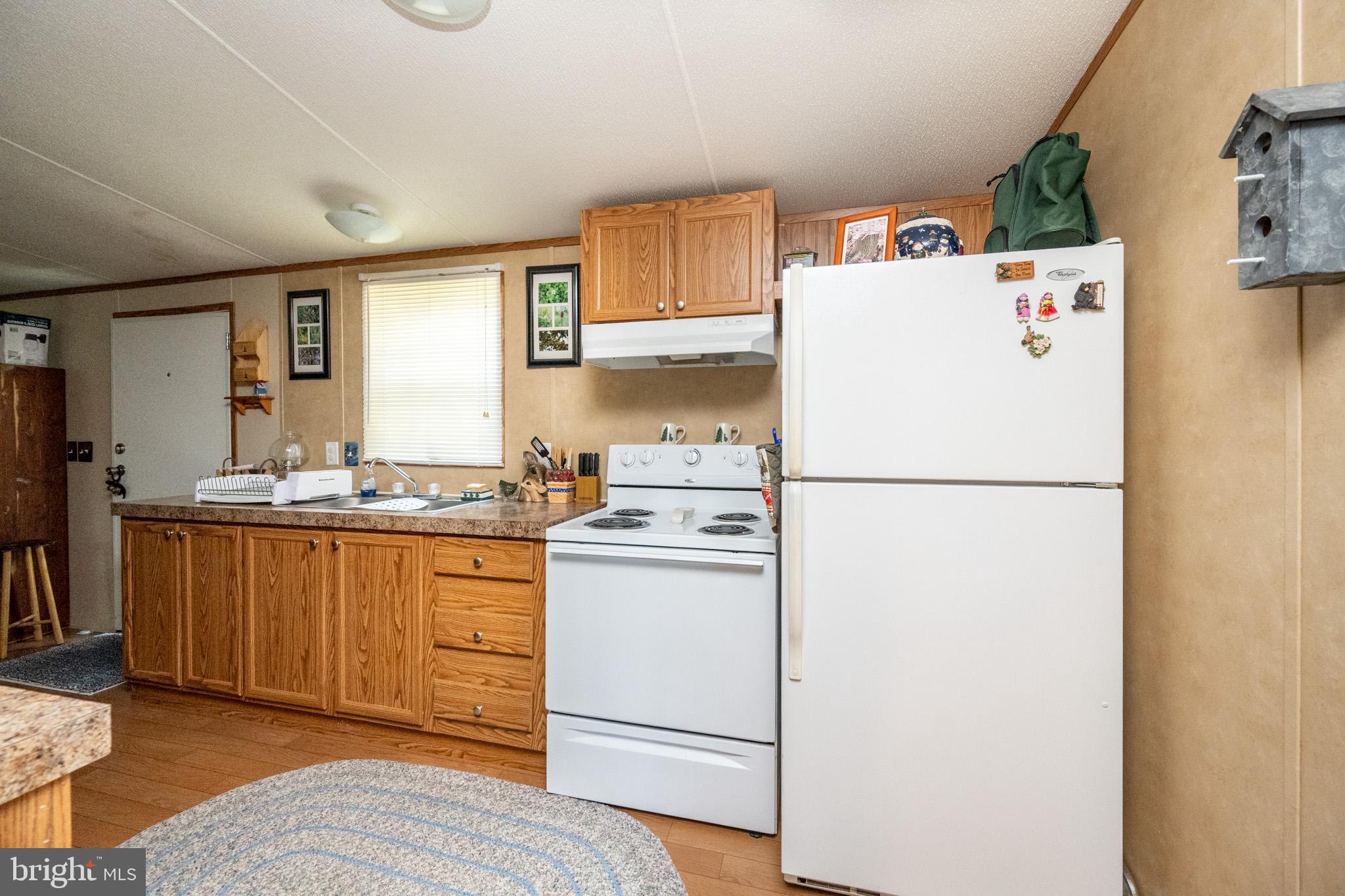 6932 New Germany Road Grantsville, MD 21536 - Photo 25 of 31 Cozy kitchen with warm wooden accents.