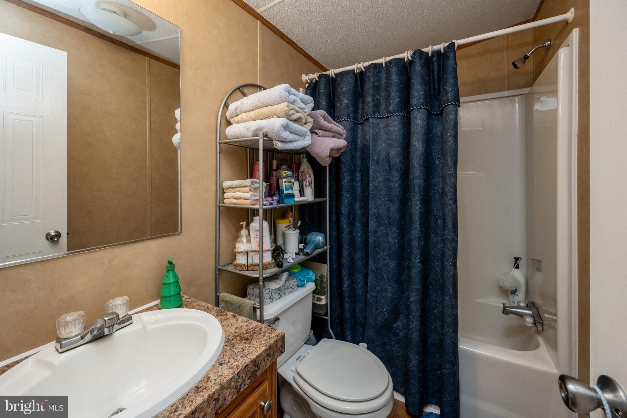 6932 New Germany Road Grantsville, MD 21536 - Photo 27 of 31 Cozy bathroom with modern amenities.