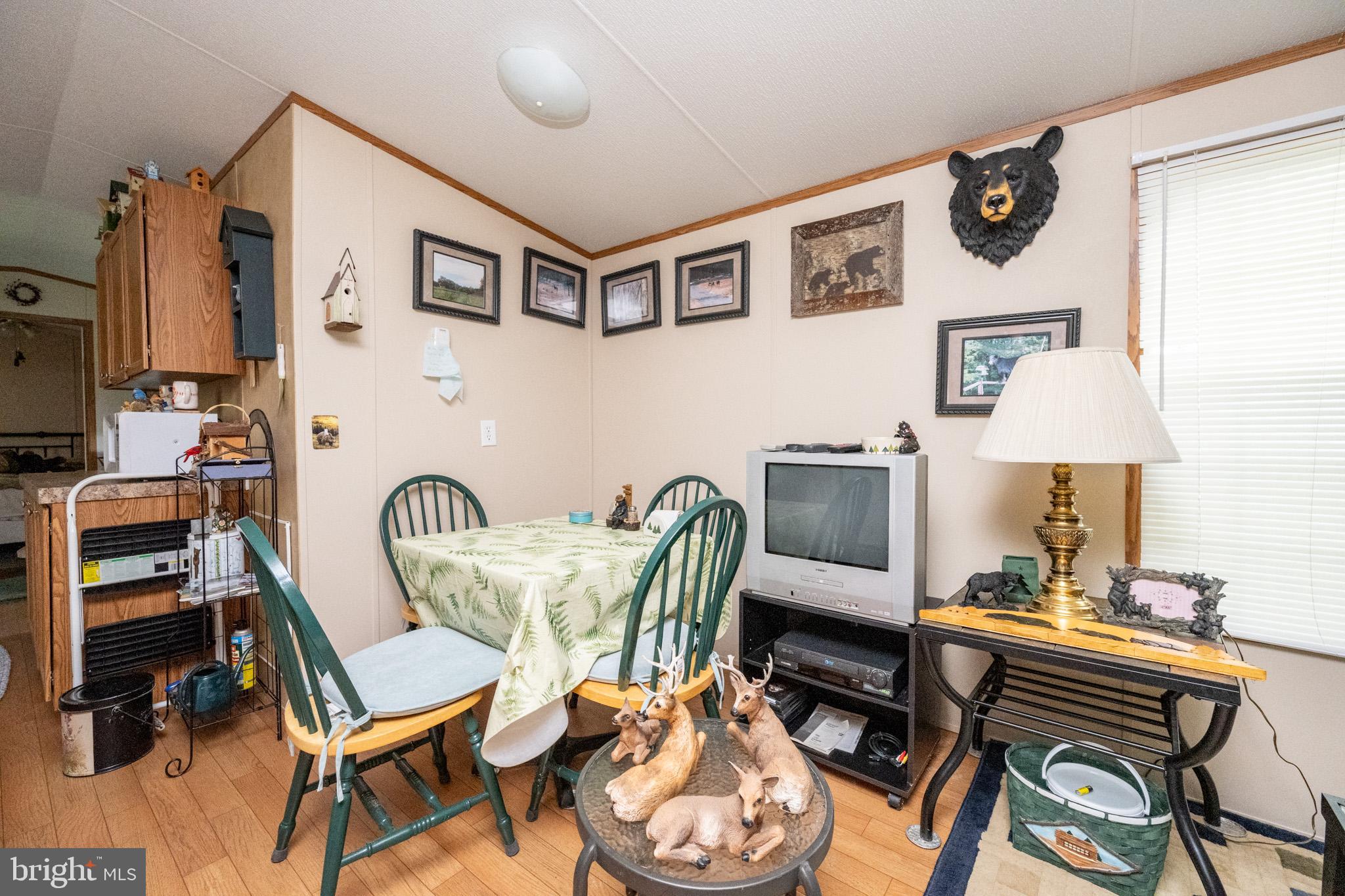 6932 New Germany Road Grantsville, MD 21536 - Photo 5 of 31 Cozy dining area with rustic charm.
